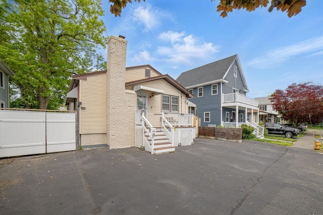 26 Hanna St, Quincy, MA 02169 - view of front facade with a chimney