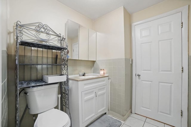 26 Hanna St, Quincy, MA 02169 - bathroom featuring tile walls, toilet, vanity, tile patterned floors, and wainscoting