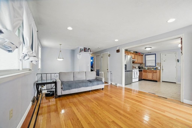 26 Hanna St, Quincy, MA 02169 - living room featuring light wood-style floors, baseboards, and recessed lighting