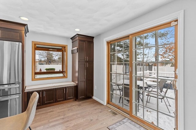 doorway with light hardwood / wood-style flooring