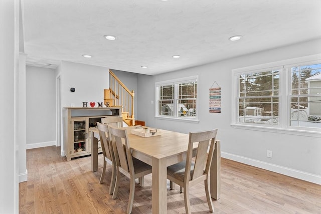 dining area with light hardwood / wood-style floors