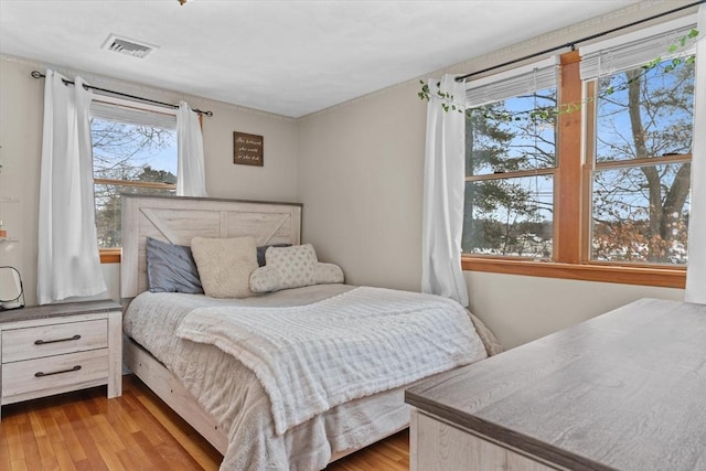 bedroom with light hardwood / wood-style flooring