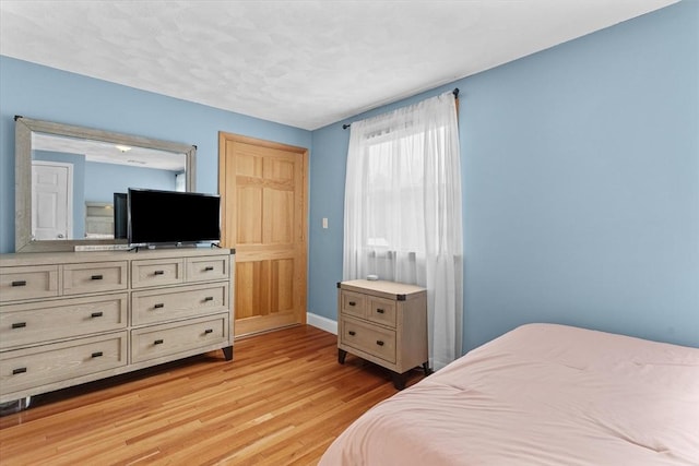 bedroom featuring light hardwood / wood-style flooring