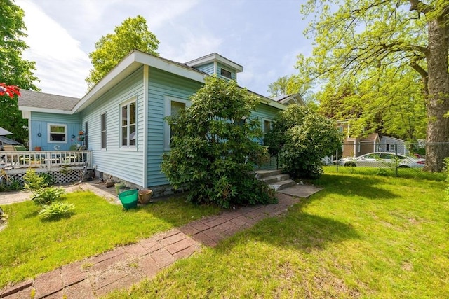 view of home's exterior featuring a deck