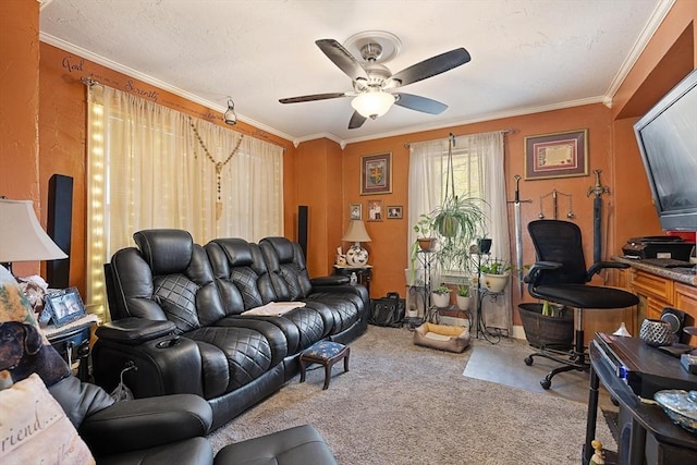 carpeted living room featuring ceiling fan and crown molding
