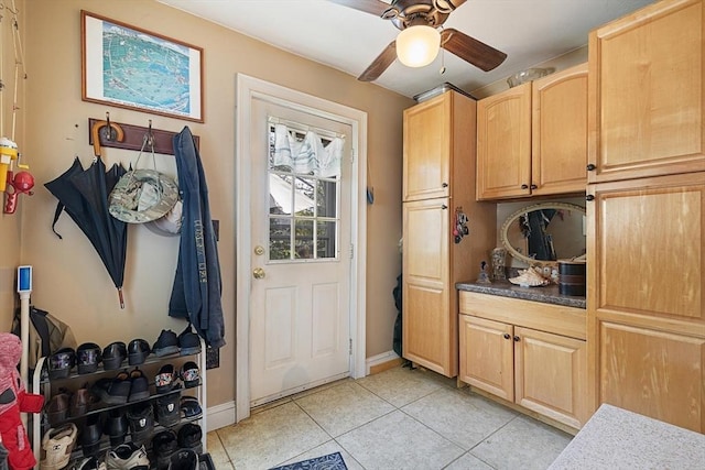 mudroom featuring light tile patterned floors, ceiling fan, and baseboards