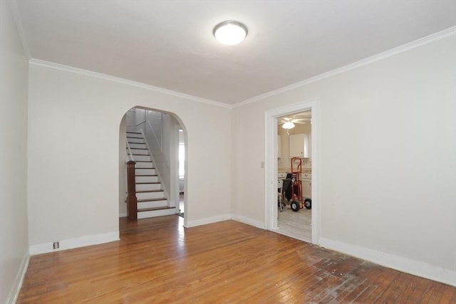 unfurnished room featuring hardwood / wood-style flooring and ornamental molding