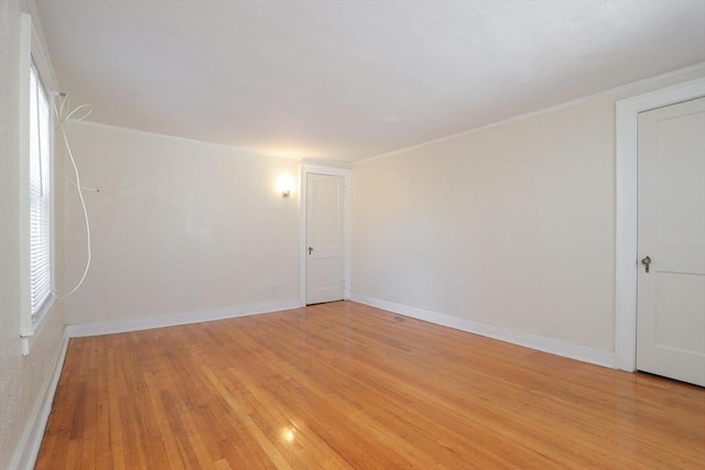 spare room with light wood-type flooring