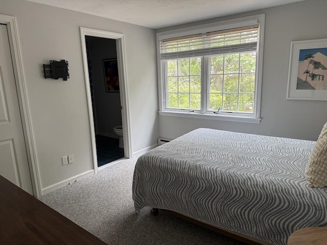 183 Monomoscoy Rd, Mashpee, MA 02649 - carpeted bedroom with baseboards and connected bathroom