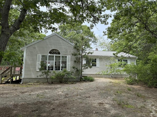 183 Monomoscoy Rd, Mashpee, MA 02649 - rear view of house with a chimney