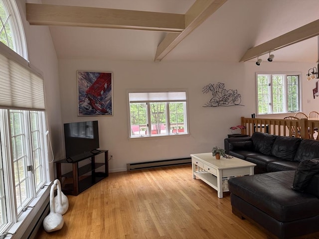 183 Monomoscoy Rd, Mashpee, MA 02649 - living room with baseboard heating, light wood-style floors, track lighting, and a chandelier