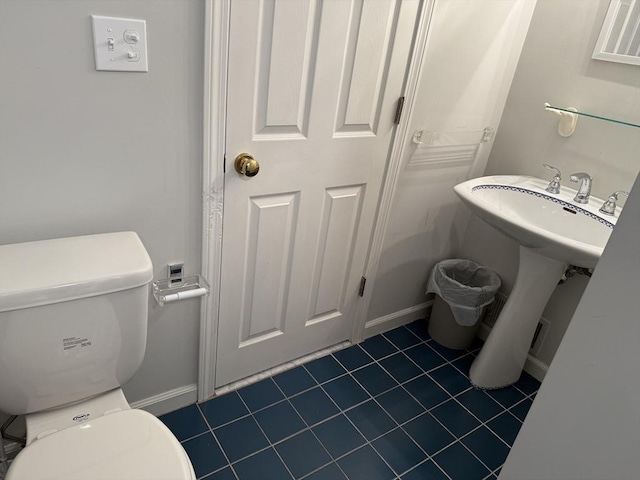 183 Monomoscoy Rd, Mashpee, MA 02649 - half bath featuring toilet and tile patterned floors