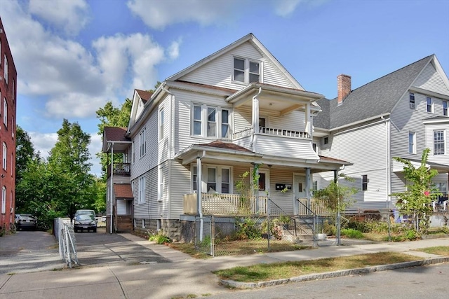 view of front of house with a balcony and a porch