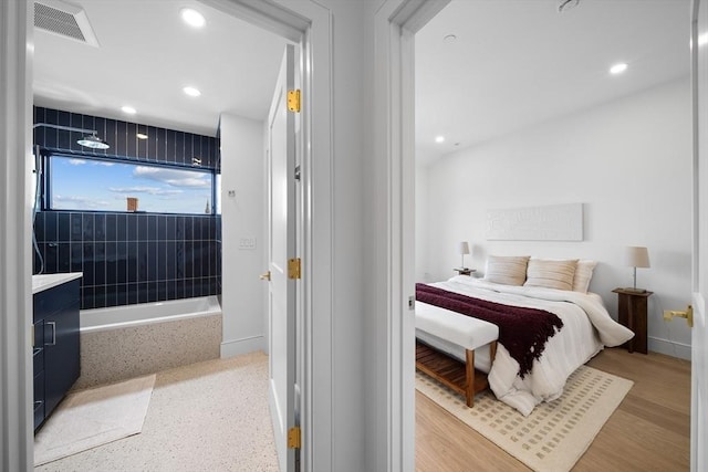 bedroom featuring recessed lighting and baseboards