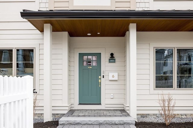 property entrance featuring covered porch