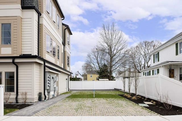 fenced backyard featuring a patio area