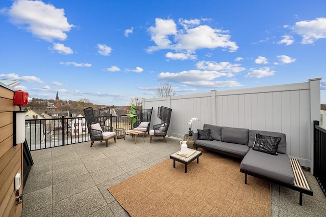 view of patio featuring an outdoor living space and a balcony