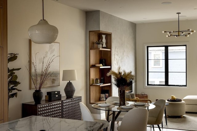 dining space featuring a chandelier