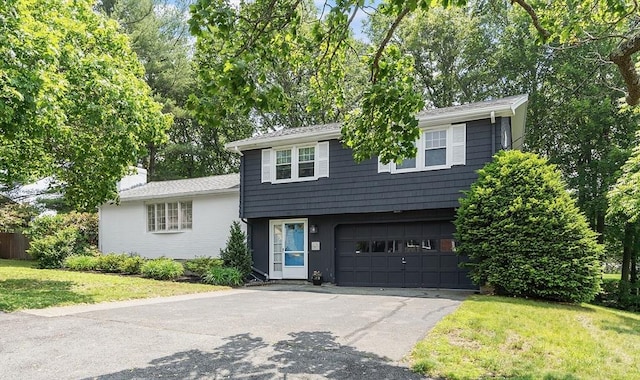 5 Summit View Dr, Swampscott, MA 01907 - split level home with an attached garage, asphalt driveway, a front yard, and a chimney