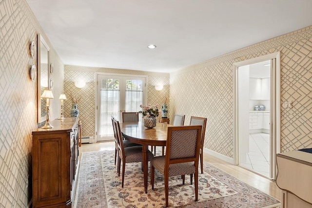 5 Summit View Dr, Swampscott, MA 01907 - dining area with wallpapered walls, a baseboard radiator, light wood-style flooring, and french doors