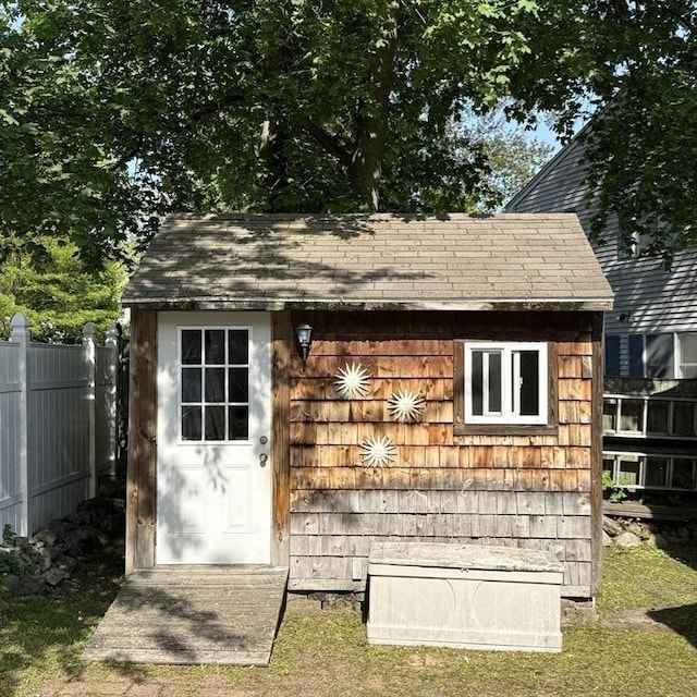 view of shed with fence