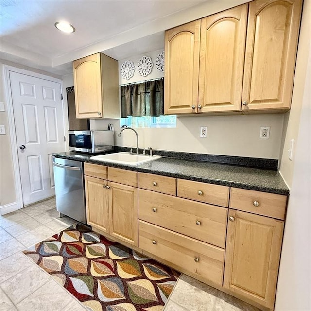 kitchen featuring light brown cabinets, appliances with stainless steel finishes, a sink, and recessed lighting
