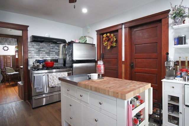 116 Muzzy St, Chicopee, MA 01020 - kitchen featuring appliances with stainless steel finishes, range hood, butcher block counters, dark wood-type flooring, and white cabinets