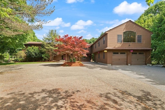 364 Chestnut St, Wilmington, MA 01887 - view of front of house featuring driveway and an attached garage