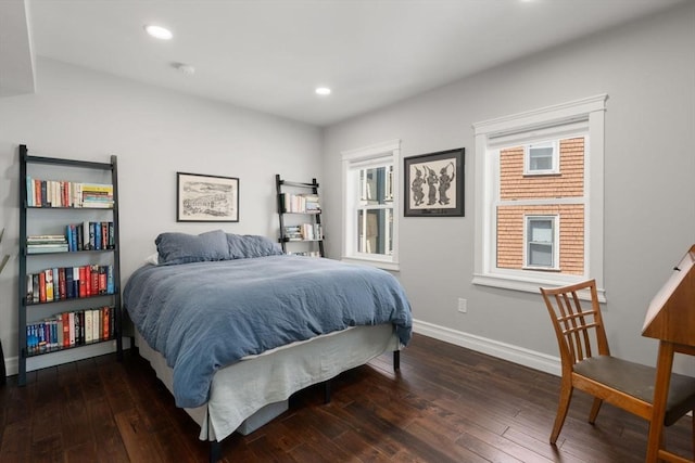 bedroom featuring baseboards, multiple windows, recessed lighting, and hardwood / wood-style floors