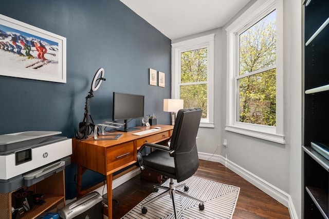 home office featuring baseboards and wood finished floors