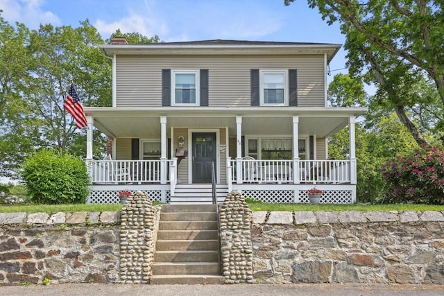 20 Houghton St, Webster, MA 01570 - view of front of property featuring a chimney and covered porch