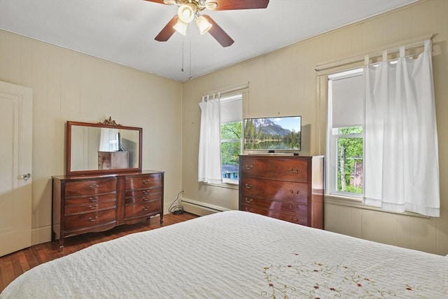 20 Houghton St, Webster, MA 01570 - bedroom with multiple windows, wood finished floors, a baseboard radiator, and ceiling fan
