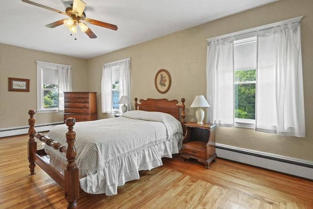 20 Houghton St, Webster, MA 01570 - bedroom with wood finished floors, ceiling fan, and a baseboard heating unit