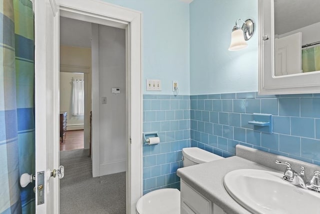 20 Houghton St, Webster, MA 01570 - bathroom featuring vanity, tile walls, a wainscoted wall, baseboard heating, and curtained shower
