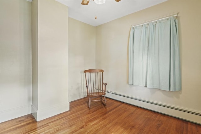 20 Houghton St, Webster, MA 01570 - unfurnished room featuring baseboard heating, ceiling fan, and wood finished floors
