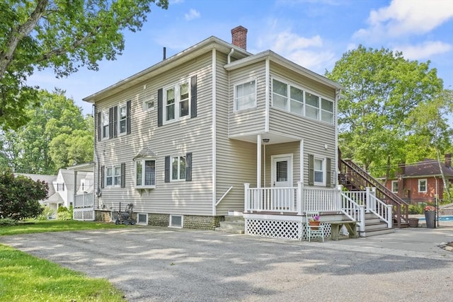20 Houghton St, Webster, MA 01570 - view of front facade featuring a chimney