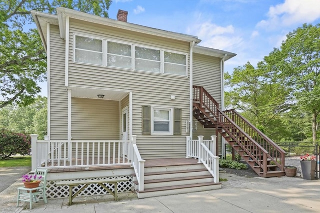 20 Houghton St, Webster, MA 01570 - view of front of house with stairway and a chimney
