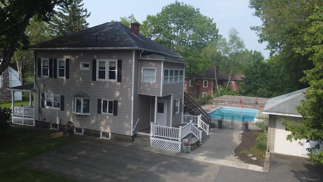 20 Houghton St, Webster, MA 01570 - rear view of property featuring a chimney