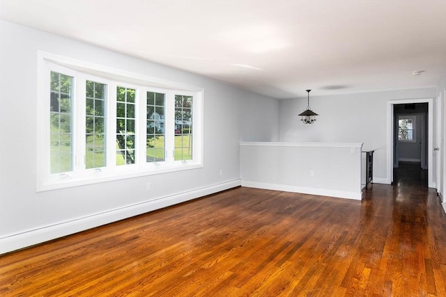 38 Juniper Ln, Holden, MA 01520 - empty room with dark wood-style flooring, a baseboard radiator, and baseboards