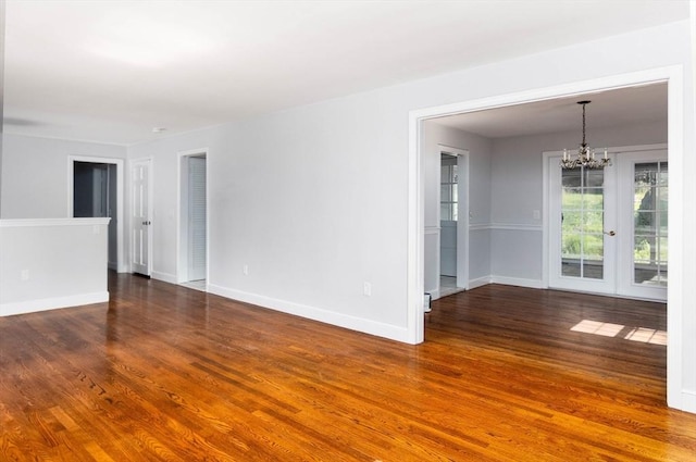38 Juniper Ln, Holden, MA 01520 - unfurnished room featuring a chandelier, wood finished floors, and baseboards