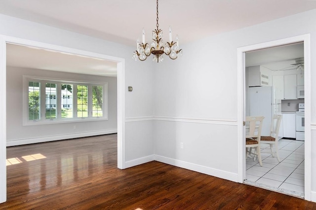 38 Juniper Ln, Holden, MA 01520 - unfurnished dining area featuring baseboard heating, wood finished floors, a chandelier, and baseboards