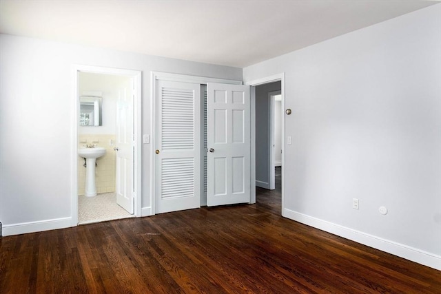 38 Juniper Ln, Holden, MA 01520 - unfurnished bedroom featuring baseboards, a closet, dark wood-style flooring, and ensuite bath