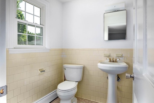 38 Juniper Ln, Holden, MA 01520 - bathroom with tile walls, toilet, wainscoting, tile patterned floors, and a baseboard heating unit