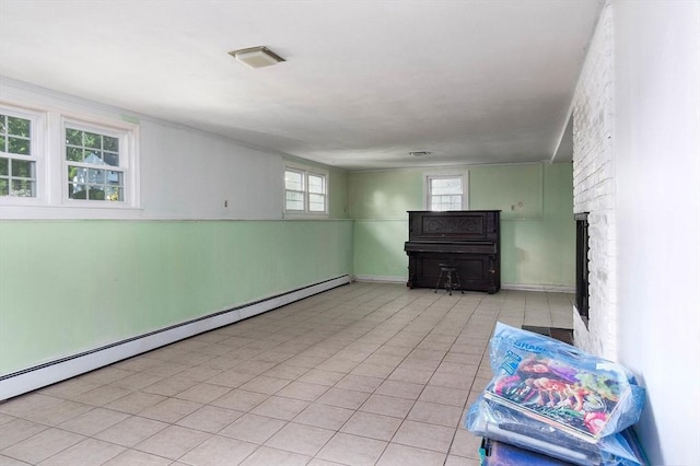 38 Juniper Ln, Holden, MA 01520 - unfurnished living room featuring baseboard heating, a large fireplace, and tile patterned flooring