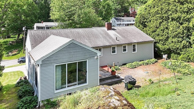 38 Juniper Ln, Holden, MA 01520 - back of house featuring a chimney and roof with shingles
