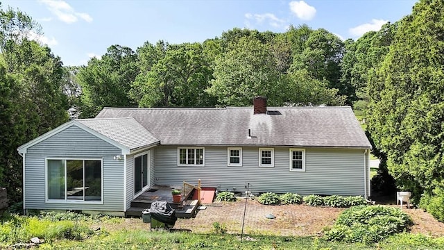 38 Juniper Ln, Holden, MA 01520 - rear view of property featuring a chimney
