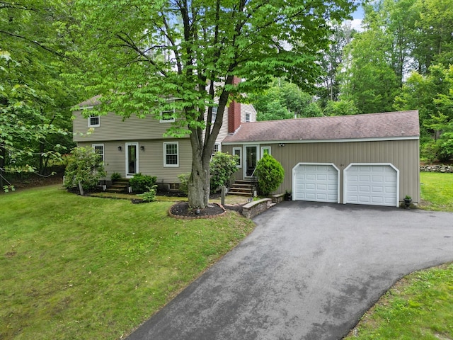 124 Hillside Rd, North Andover, MA 01845 - colonial house with an attached garage, driveway, a front lawn, and roof with shingles