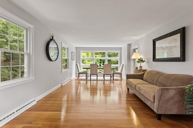 124 Hillside Rd, North Andover, MA 01845 - living area featuring a baseboard radiator and light wood-style flooring