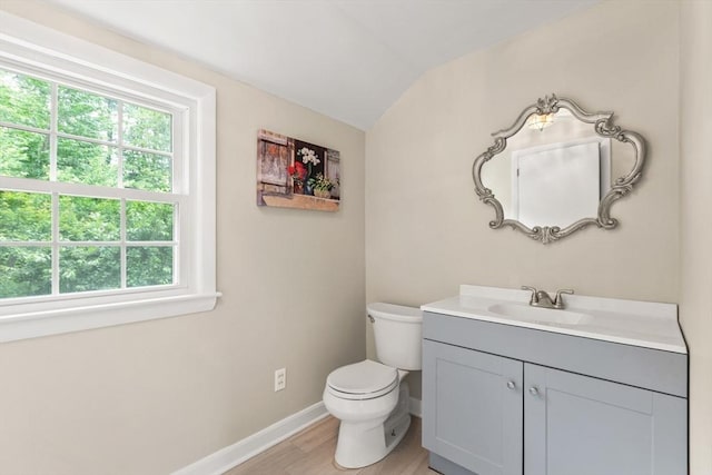 124 Hillside Rd, North Andover, MA 01845 - bathroom featuring lofted ceiling, vanity, and wood finished floors