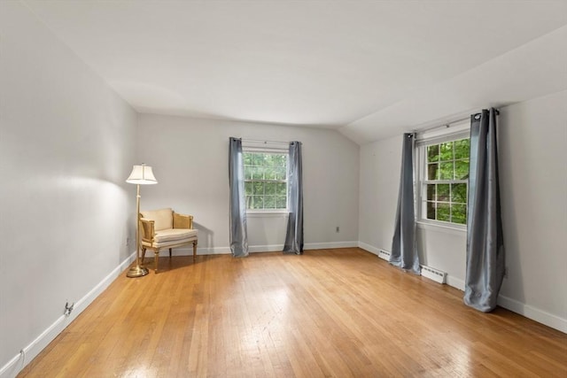 124 Hillside Rd, North Andover, MA 01845 - unfurnished room with healthy amount of natural light, light wood finished floors, and vaulted ceiling